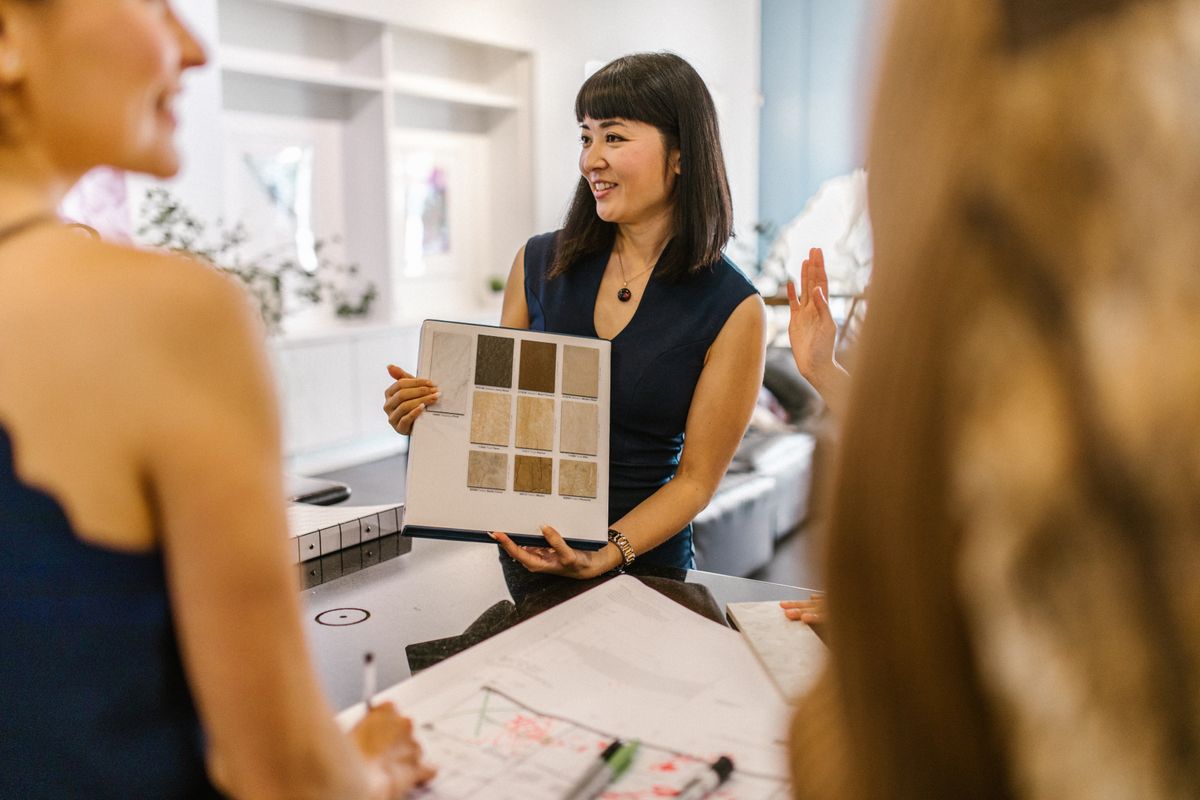 A designer showing colour samples to a client